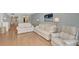 Living area with hardwood floors, neutral tones, and ample seating at 255 The Esplanade N # 603, Venice, FL 34285