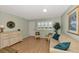 Living room with light walls, hardwood floors, and coastal decor at 255 The Esplanade N # 603, Venice, FL 34285