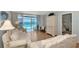 Living room features ocean view, light colored furniture, and hardwood floors at 255 The Esplanade N # 603, Venice, FL 34285
