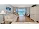 Living room with ocean view, light flooring, and comfortable seating at 255 The Esplanade N # 603, Venice, FL 34285