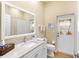 Bathroom featuring a white vanity with stone countertop, a toilet, and walk in shower at 305 Rio Terra, Venice, FL 34285