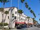 Historic Venice building, featuring shops and restaurants, situated on a tree-lined street at 305 Rio Terra, Venice, FL 34285