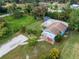 Aerial view of a small blue house on a large lot at 4533 Church St, Punta Gorda, FL 33980