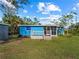 Back of blue house showing a deck and screened porch at 4533 Church St, Punta Gorda, FL 33980