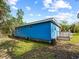 Blue house exterior with a deck and fenced backyard at 4533 Church St, Punta Gorda, FL 33980