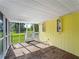 Bright yellow screened porch overlooking the backyard at 4533 Church St, Punta Gorda, FL 33980