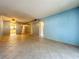 Open living space showcasing tile flooring and access to other rooms, offering a bright and airy atmosphere at 509 Parkdale Mews # 509, Venice, FL 34285
