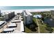 Aerial view of condo building near beach, pool, and pond at 5790 Midnight Pass Rd # 602, Sarasota, FL 34242