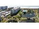 Beachfront condo with pond, bridge, and tropical landscaping at 5790 Midnight Pass Rd # 602, Sarasota, FL 34242