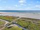 Beach access with boardwalk leading to sandy shore at 5790 Midnight Pass Rd # 602, Sarasota, FL 34242