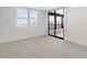 Bright bedroom with sliding door to balcony at 5790 Midnight Pass Rd # 602, Sarasota, FL 34242