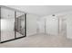 Bedroom with sliding doors to private balcony and bathroom at 5790 Midnight Pass Rd # 602, Sarasota, FL 34242