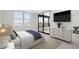 Main bedroom with large window, dresser, and balcony access at 5790 Midnight Pass Rd # 602, Sarasota, FL 34242