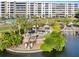 Relaxing community space with tables, chairs, and waterfront views at 5790 Midnight Pass Rd # 602, Sarasota, FL 34242