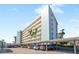 Condo building showcasing multiple levels and parking at 5790 Midnight Pass Rd # 602, Sarasota, FL 34242