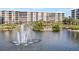 Water fountain in a tropical setting near condo building at 5790 Midnight Pass Rd # 602, Sarasota, FL 34242