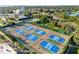Expansive pickleball courts with blue and green surfaces at 5790 Midnight Pass Rd # 602, Sarasota, FL 34242