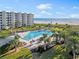 Resort-style pool with lounge chairs and beach views at 5790 Midnight Pass Rd # 602, Sarasota, FL 34242