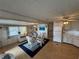 Bright dining area with a glass-top table and white wicker chairs at 611 50Th Avenue W Dr, Bradenton, FL 34207