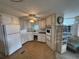 Galley kitchen offering ample cabinetry and modern appliances at 611 50Th Avenue W Dr, Bradenton, FL 34207