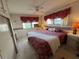 Spacious main bedroom with a king-size bed and updated decor at 611 50Th Avenue W Dr, Bradenton, FL 34207