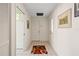 Inviting entryway with tile flooring and a unique rug at 704 Harrington Lake S Dr # 6, Venice, FL 34293