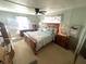 Spacious bedroom with a wooden bed frame and ample closet space at 727 Blackburn Blvd, North Port, FL 34287
