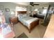 Serene bedroom, boasting a wooden bed frame and mirrored closet doors at 727 Blackburn Blvd, North Port, FL 34287