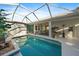 Enclosed pool and patio with seating and dining areas at 752 Grassy Oaks Dr, Venice, FL 34293