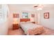 Bedroom with wood furniture and floral bedding at 872 Mohawk Rd, Venice, FL 34293