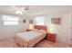 Bedroom with wood furniture and floral bedding at 872 Mohawk Rd, Venice, FL 34293