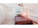 Bedroom with brown bedding and ceiling fan at 872 Mohawk Rd, Venice, FL 34293