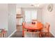 Dining area with an octagonal wood table and access to the kitchen at 872 Mohawk Rd, Venice, FL 34293