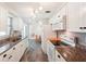 Bright kitchen with white cabinets and tiled floor at 872 Mohawk Rd, Venice, FL 34293