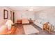 Living room with tiled floors, wicker furniture, and a ceiling fan at 872 Mohawk Rd, Venice, FL 34293