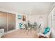 Bright sunroom with glass doors and wicker furniture at 872 Mohawk Rd, Venice, FL 34293