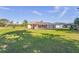 Large backyard with screened enclosure at 9325 Crugar Ter, Englewood, FL 34224