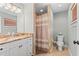 Clean bathroom with granite countertop and a shower/tub combo at 9325 Crugar Ter, Englewood, FL 34224