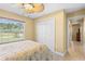 Bright bedroom with window and double doors at 9325 Crugar Ter, Englewood, FL 34224