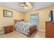 Guest bedroom with a double bed and a ceiling fan at 9325 Crugar Ter, Englewood, FL 34224