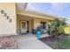 Inviting front porch with seating area, perfect for relaxing outdoors at 9325 Crugar Ter, Englewood, FL 34224