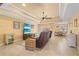 Spacious living room with comfortable seating and a large TV at 9325 Crugar Ter, Englewood, FL 34224