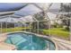 Relaxing pool area with screened enclosure at 9325 Crugar Ter, Englewood, FL 34224
