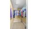 Large walk-in closet with ample hanging space and shelving at 9325 Crugar Ter, Englewood, FL 34224