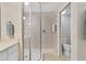 Bathroom with shower, toilet, and double vanity at 9607 Sea Turtle Ter # 101, Bradenton, FL 34212