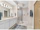 Spa-like bathroom with double vanity and shower at 9607 Sea Turtle Ter # 101, Bradenton, FL 34212