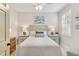 Comfortable bedroom with a queen-size bed and plenty of natural light at 9607 Sea Turtle Ter # 101, Bradenton, FL 34212
