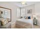 Charming bedroom with full-size bed and large mirror at 9607 Sea Turtle Ter # 101, Bradenton, FL 34212