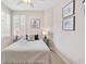 Serene bedroom with a queen-size bed and window shutters at 9607 Sea Turtle Ter # 101, Bradenton, FL 34212