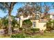 Attractive two-story townhome with lush landscaping and trees at 9607 Sea Turtle Ter # 101, Bradenton, FL 34212